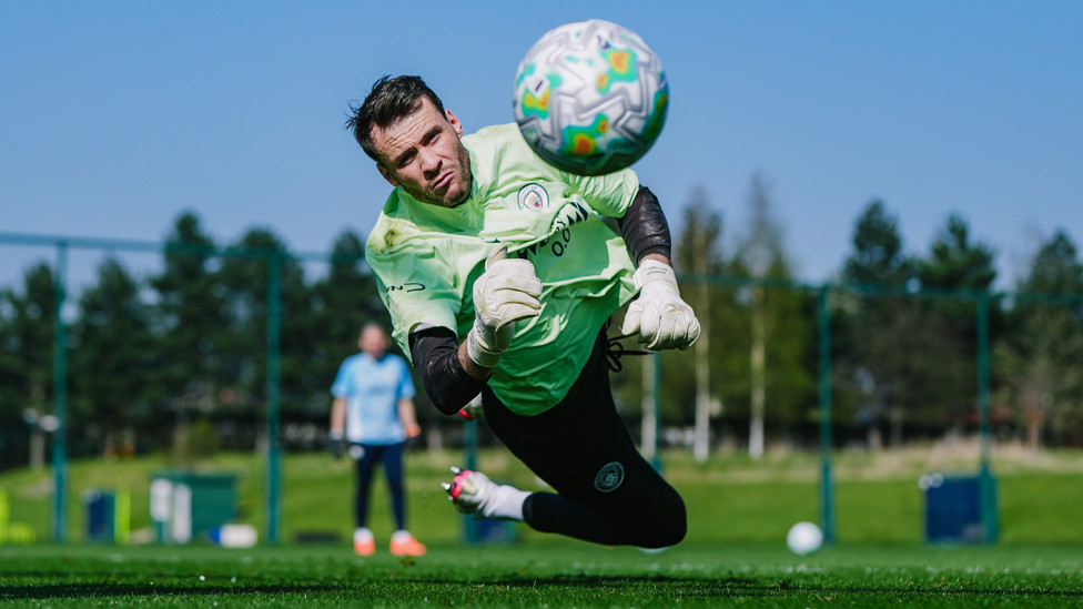 SAVE  : Marcus Bettinelli gets low to his right.