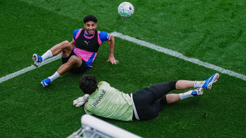 FLOORED GENUISES : Omar Marmoush and James Trafford scramble for the ball