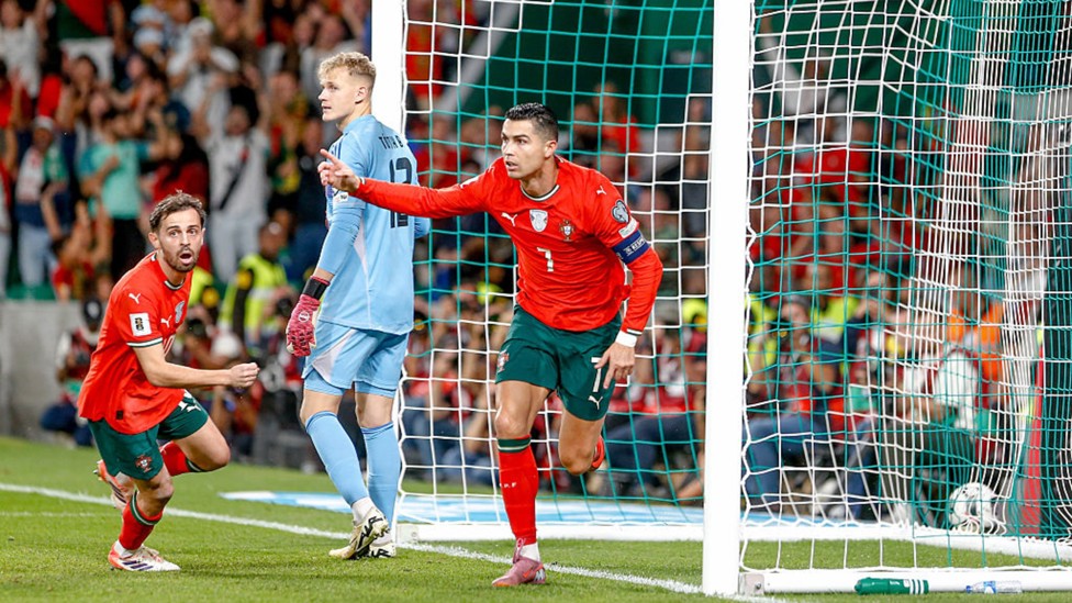 CELEBRATION TIME: Bernardo Silva and Cristiano Ronaldo react after Portugal's opener.
