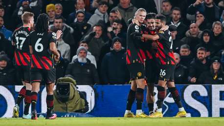 CELEBRATE: The players celebrate the second goal.