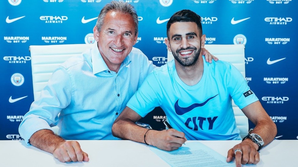 PEN TO PAPER : Riyad Mahrez moved north from Leicester to Manchester, signing his contract with the Club on 10 July 2018. 