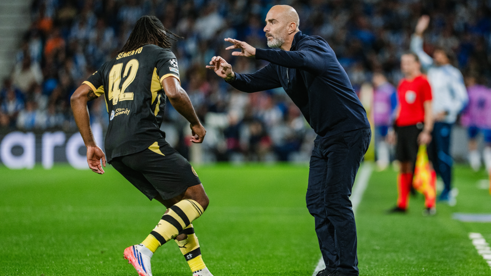 EAGER ENZO : The boss passes on instructions from the touchline.
