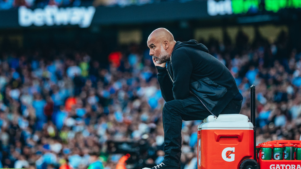 PEP PONDERS : The boss on the touchline.