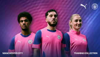 Image of Manchester City players showcasing the Puma training collection. The kit is predominantly pink with blue accents and features the Manchester City logo.