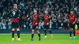 SETBACK: The players look dejected after Kane opens the scoring.