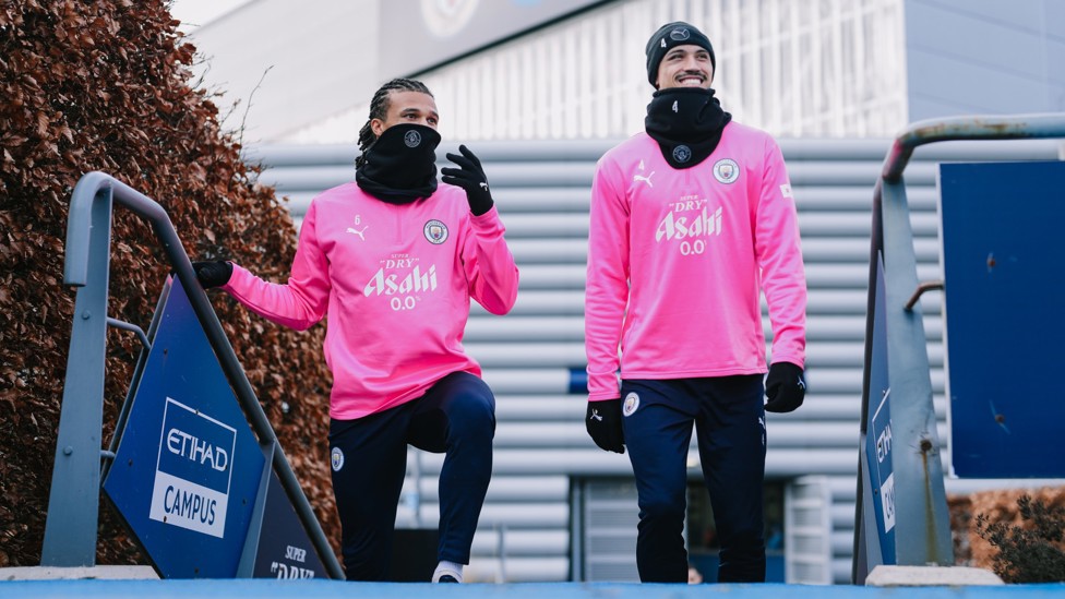 HERE THEY COME : Nathan Ake and Tijjani Reijnders head out into the cold