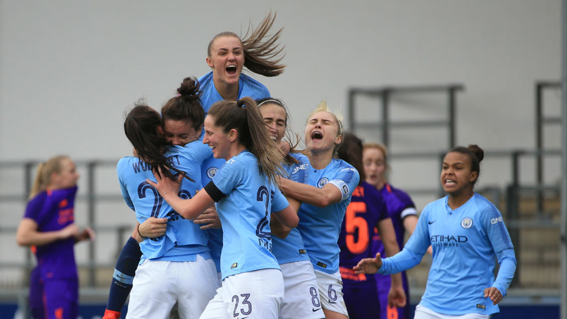 THAT WINNING FEELING: The Blues celebrate Jen Beattie's all-important last-gasp winner