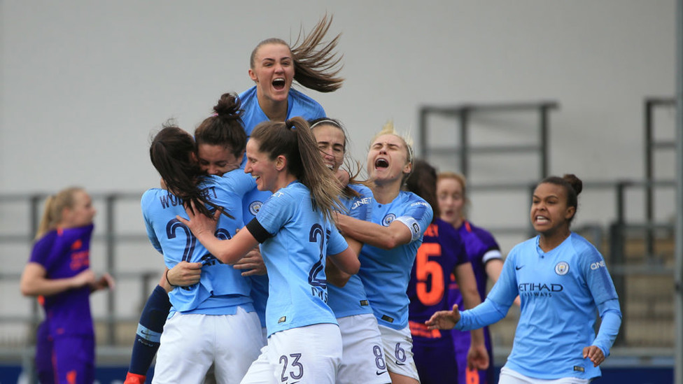 THAT WINNING FEELING : The Blues celebrate Jen Beattie's all-important last-gasp winner