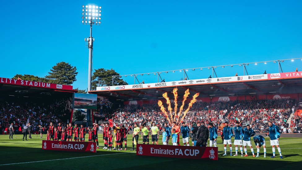 LINE-UP : The teams head out to a packed out crowd.