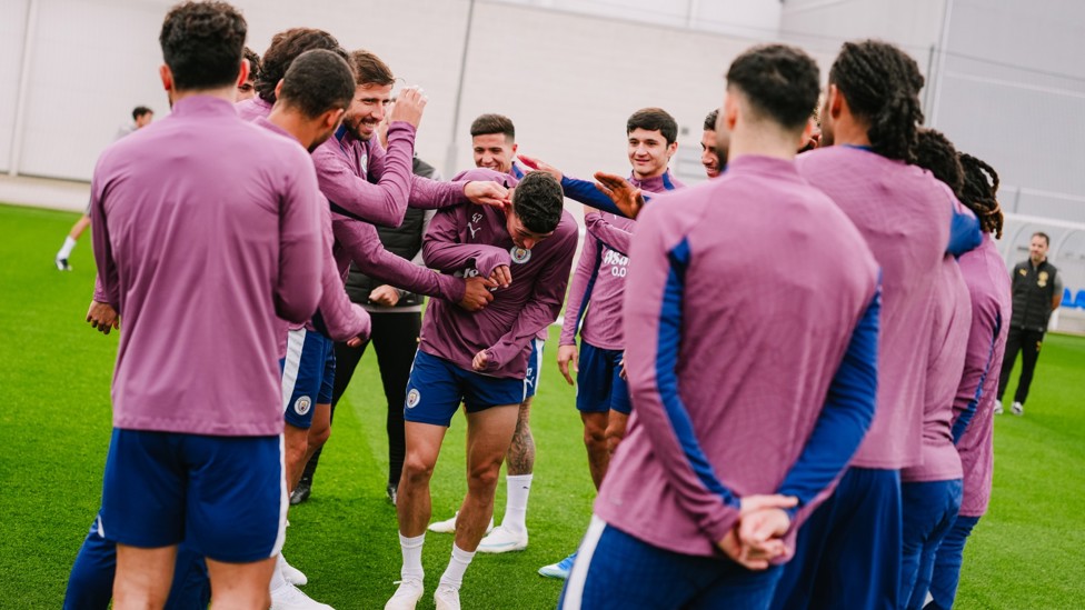 BEFORE WE BEGIN : Phil Foden receives some love from his teammates.