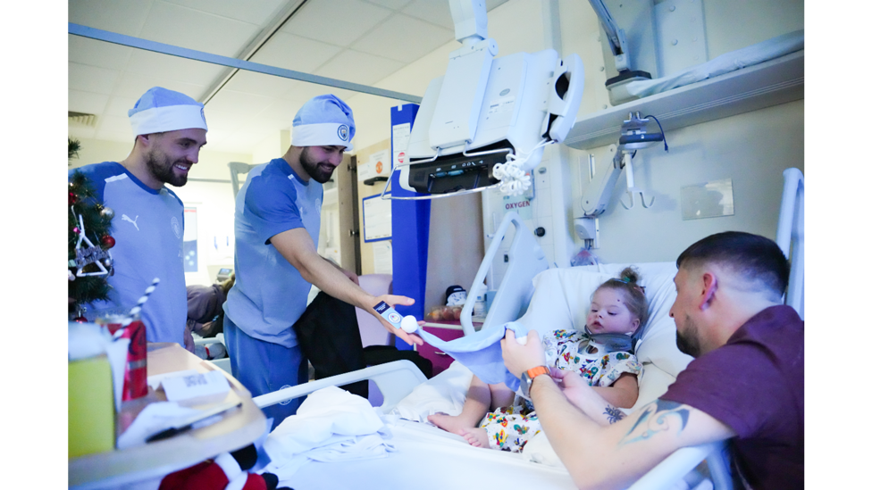 FESTIVE CHEER: Josko Gvardiol and Mateo Kovacic hand over some gifts to a young patient.