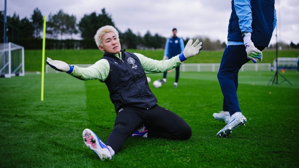 SPLIT SAVE: Yamashita dives for the ball