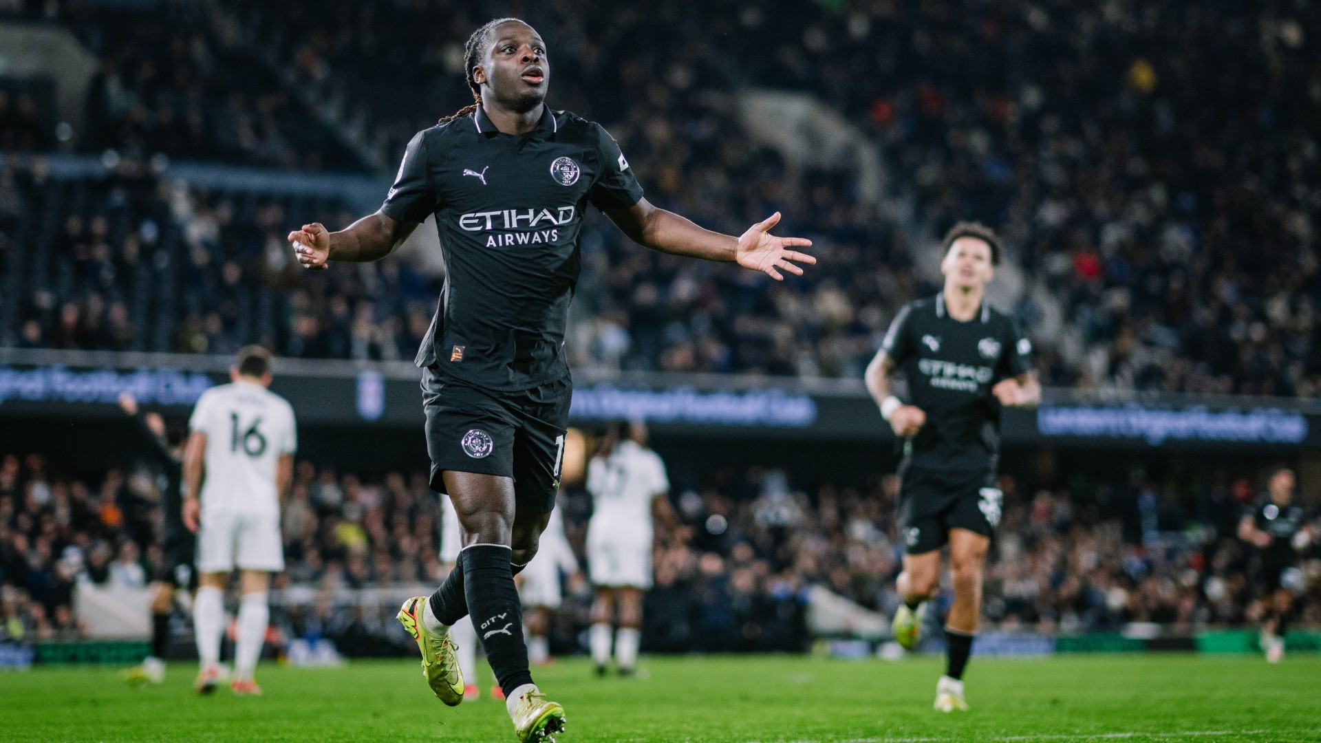 FIVE STAR: Jeremy Doku wheels away after netting City's fifth goal.