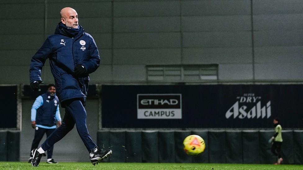 BOSSING IT : Pep Guardiola gets in on the action at the CFA