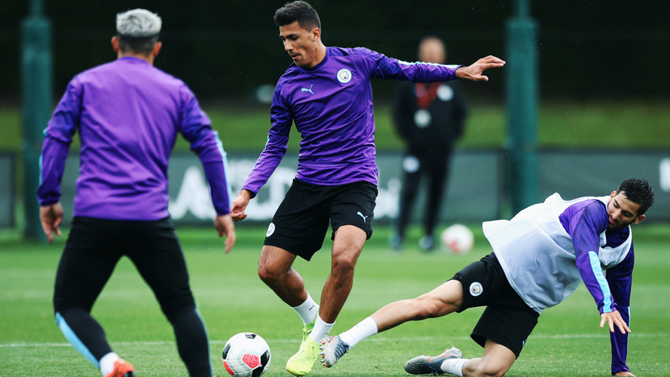 MIDFIELD ANCHOR : Rodrigo fends off a challenge