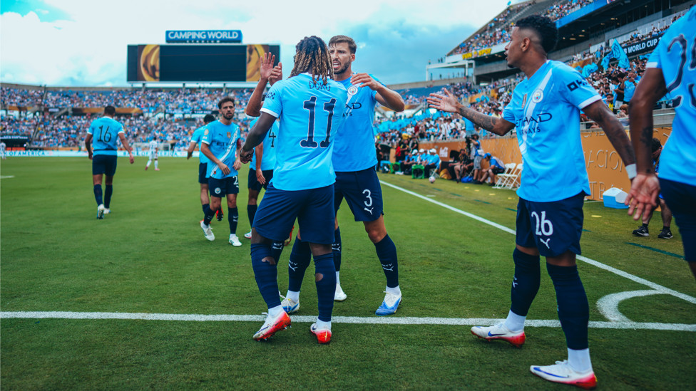 MAIN MAN : Doku feels the love after his goal.