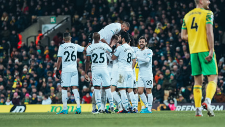 MAKE THAT TWO: Foden is mobbed after doubling the lead early in the second half.