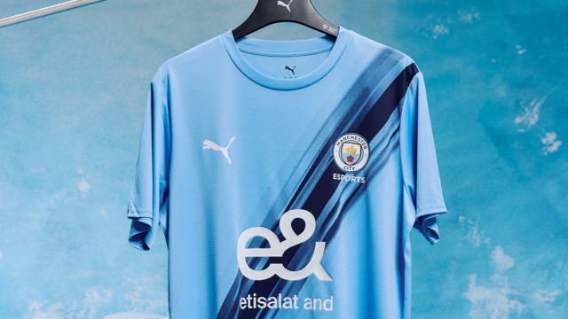 A Manchester City esports jersey featuring a gradient pattern and logos of Puma and Etisalat on a blue background.