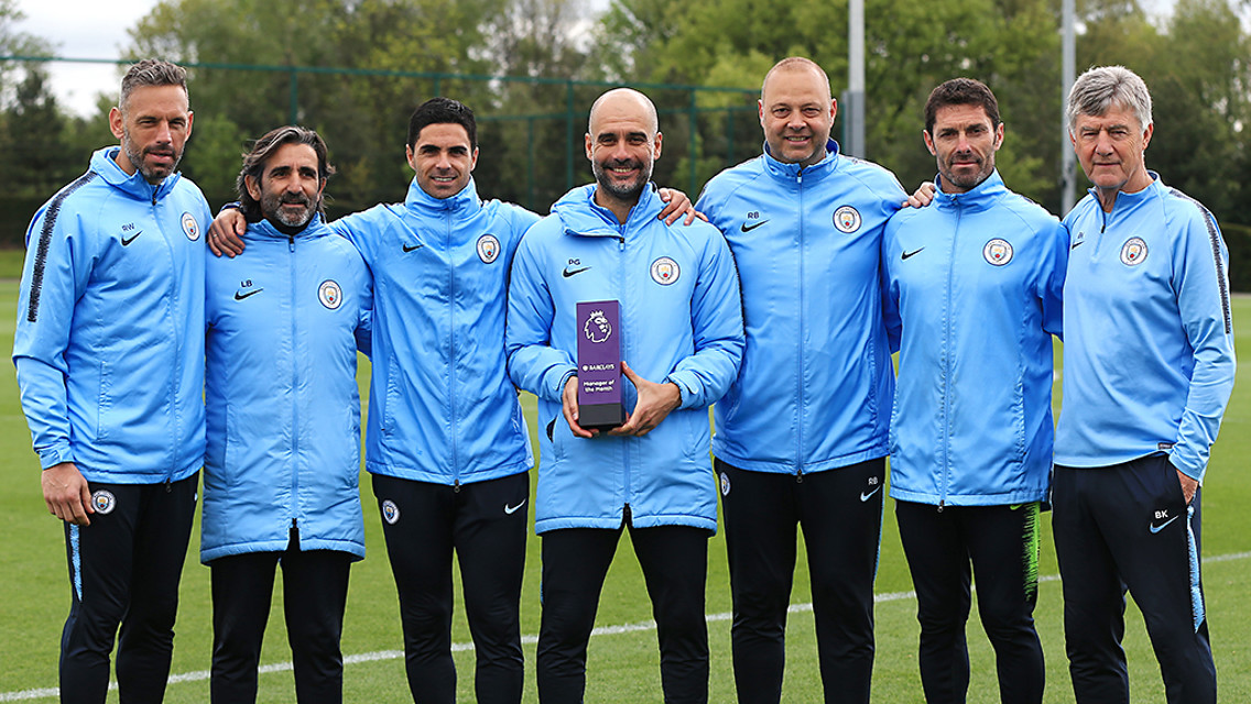 WINNER: Pep Guardiola celebrates his Manager of the Month award with his backroom staff.
