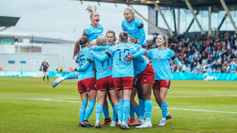 TEAM TOGETHERNESS : City's players buzzing as they celebrate Lauren Hemp's 50th goal for the Club.