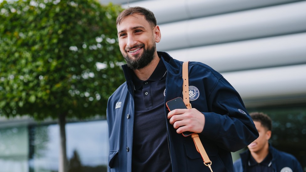 HAND IT TO GIGI: Gianluigi Donnarumma was in positive mood as City prepared to fly out. 