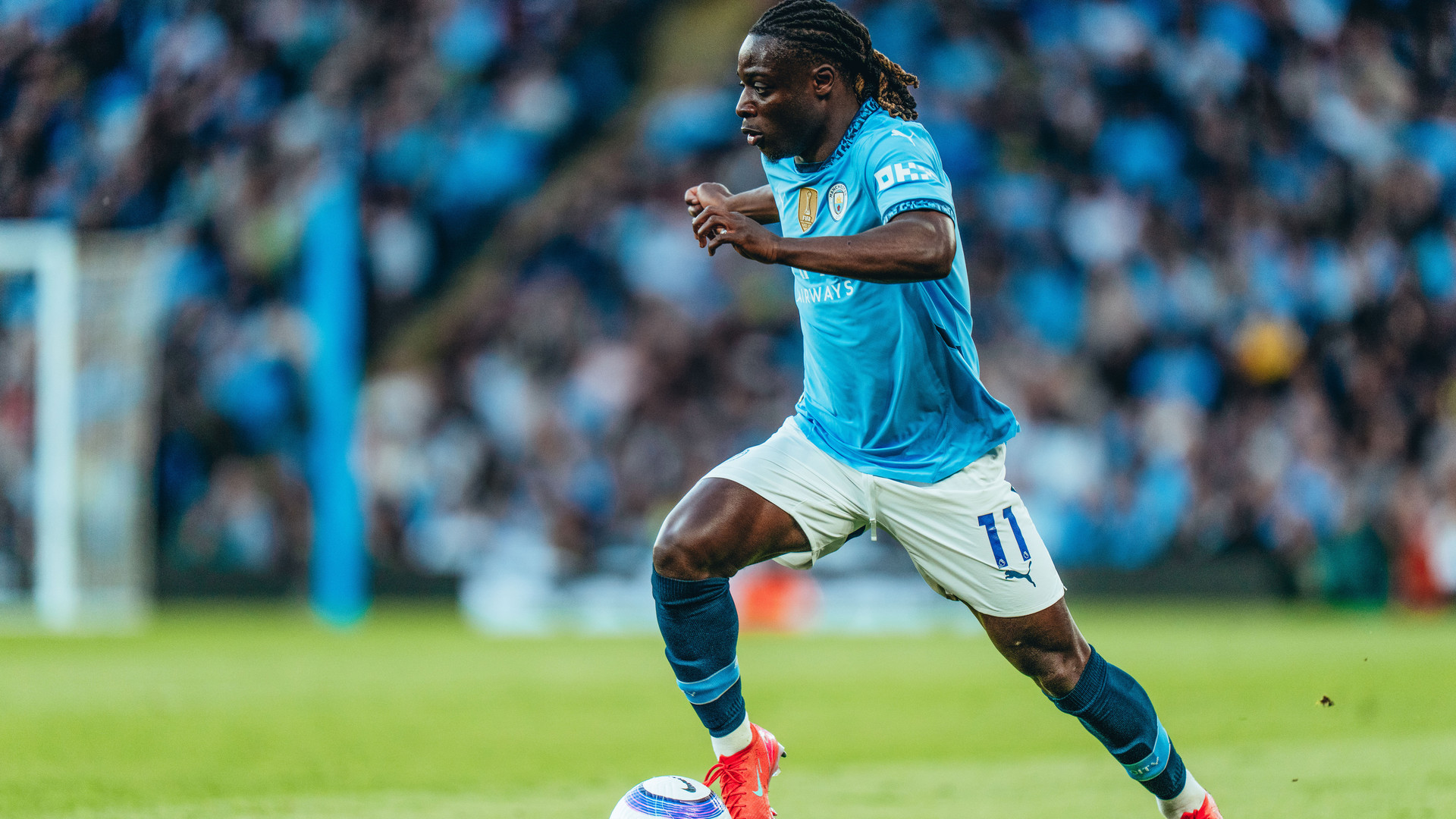 FORWARD MARCH: Jeremy Doku takes the fight to Wolves.