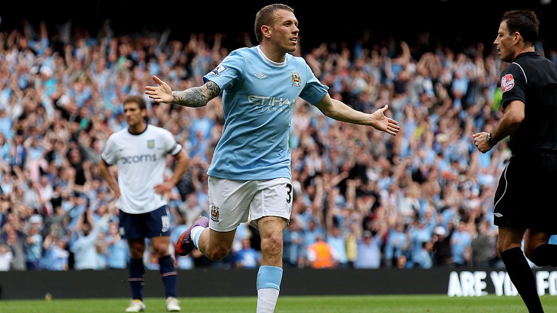 JOY: Craig Bellamy wheels away after scoring for City against Aston Villa.