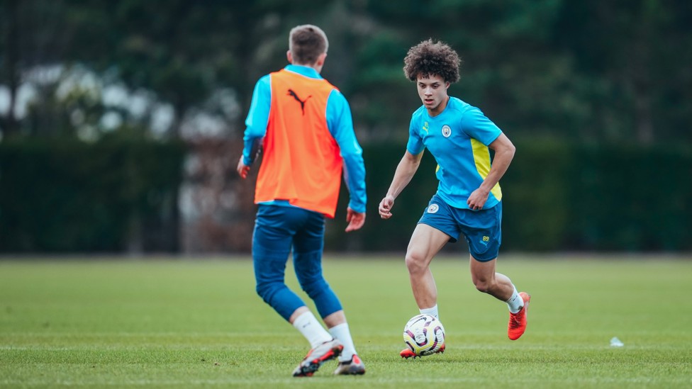 UNDER PRESSURE : Seb Naylor looks to steal possession from Matty Henderson-Hall.