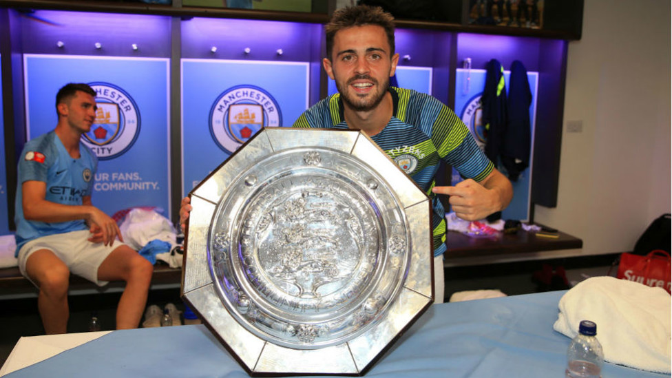 SMILES OF SUCCESS : Bernardo and City celebrate another piece of silverware after our Community Shield win over Chelsea in August 2018