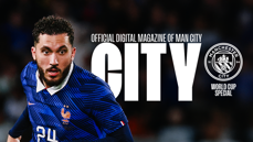 A blurred image of a football player in a blue France jersey with the number 24. Text reads 'Official Digital Magazine of Man City' with the Manchester City logo and 'World Cup Special.'