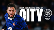 A blurred image of a football player in a blue France jersey with the number 24. Text reads 'Official Digital Magazine of Man City' with the Manchester City logo and 'World Cup Special.'