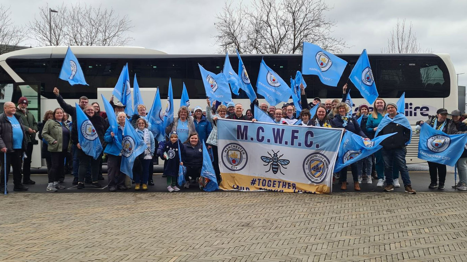 Manchester City Women's Official Supporters Club branch celebrate Continental Cup victory