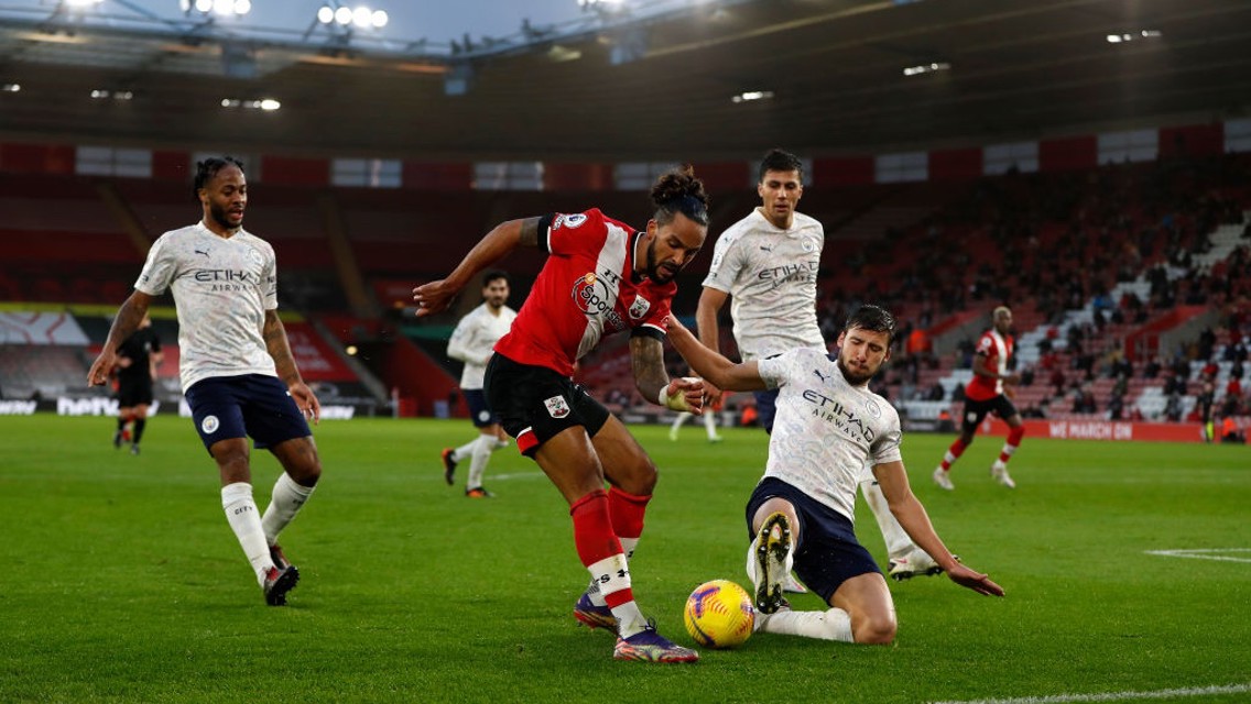 NO ENTRY: Dias slides in to block Walcott's cross.
