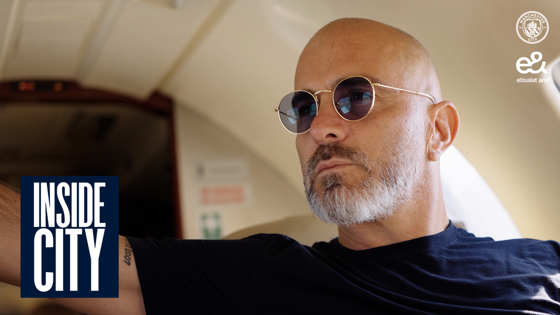 A person wearing sunglasses sits inside an aircraft, with 'Inside City' branding visible. Manchester City and Etisalat logos are in the upper right corner.