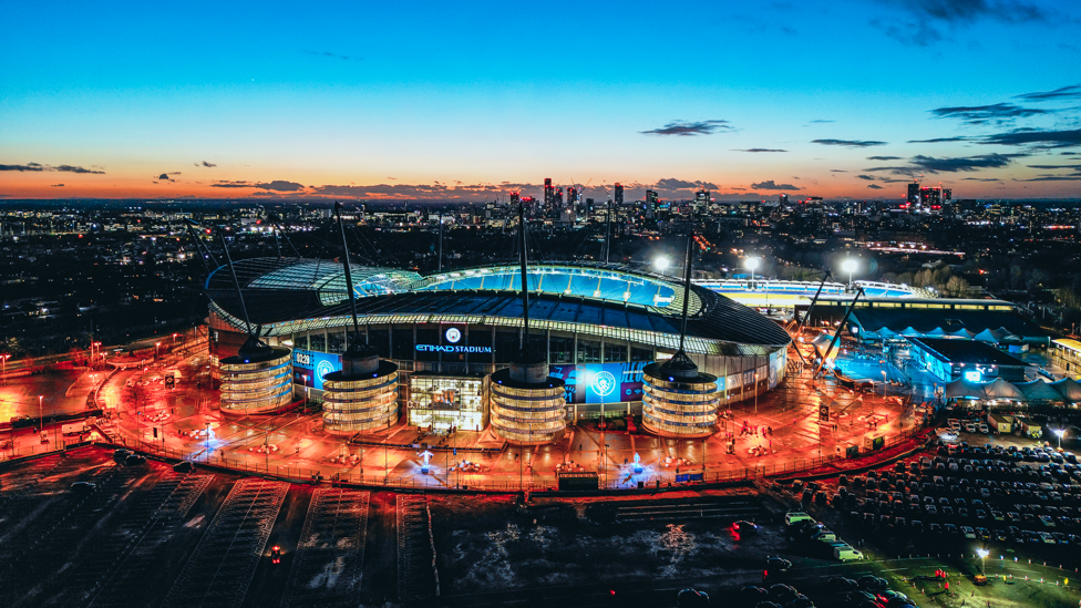 HOME: The Etihad shining bright as the Sun sets on Manchester.