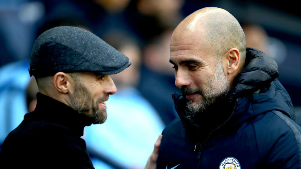 SHAKE ON IT: Pep Guardiola greets Rotherham counterpart Paul Warne