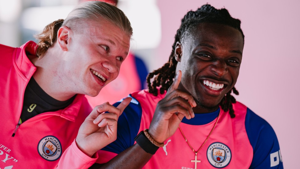 DOUBLE TROUBLE: Jeremy Doku and Erling Haaland share a laugh