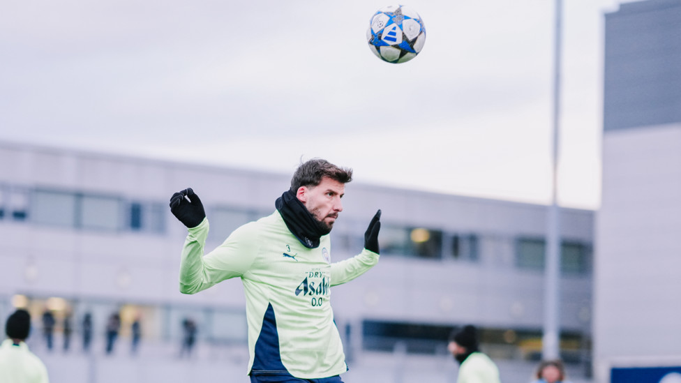 GET UP : Ruben Dias rises high to win the ball. 