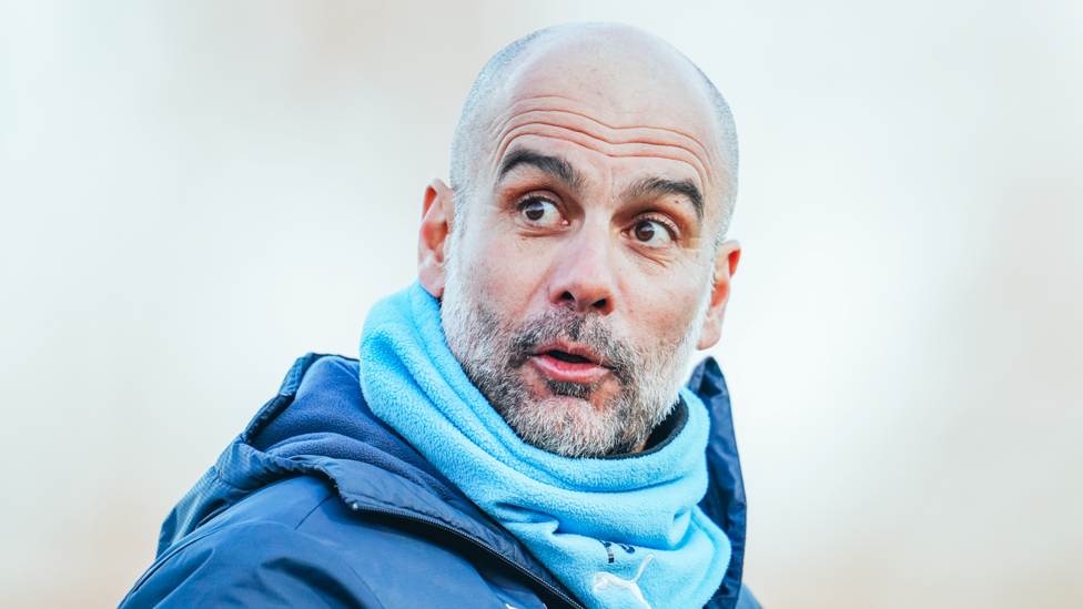 BRIGHT EYED : Pep Guardiola enjoys the clear skies over Manchester