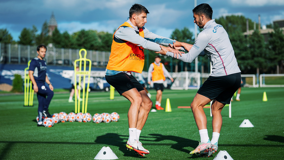 TOUCH TIGHT : Ruben Dias and Ferran Torres during one of Friday's training drills