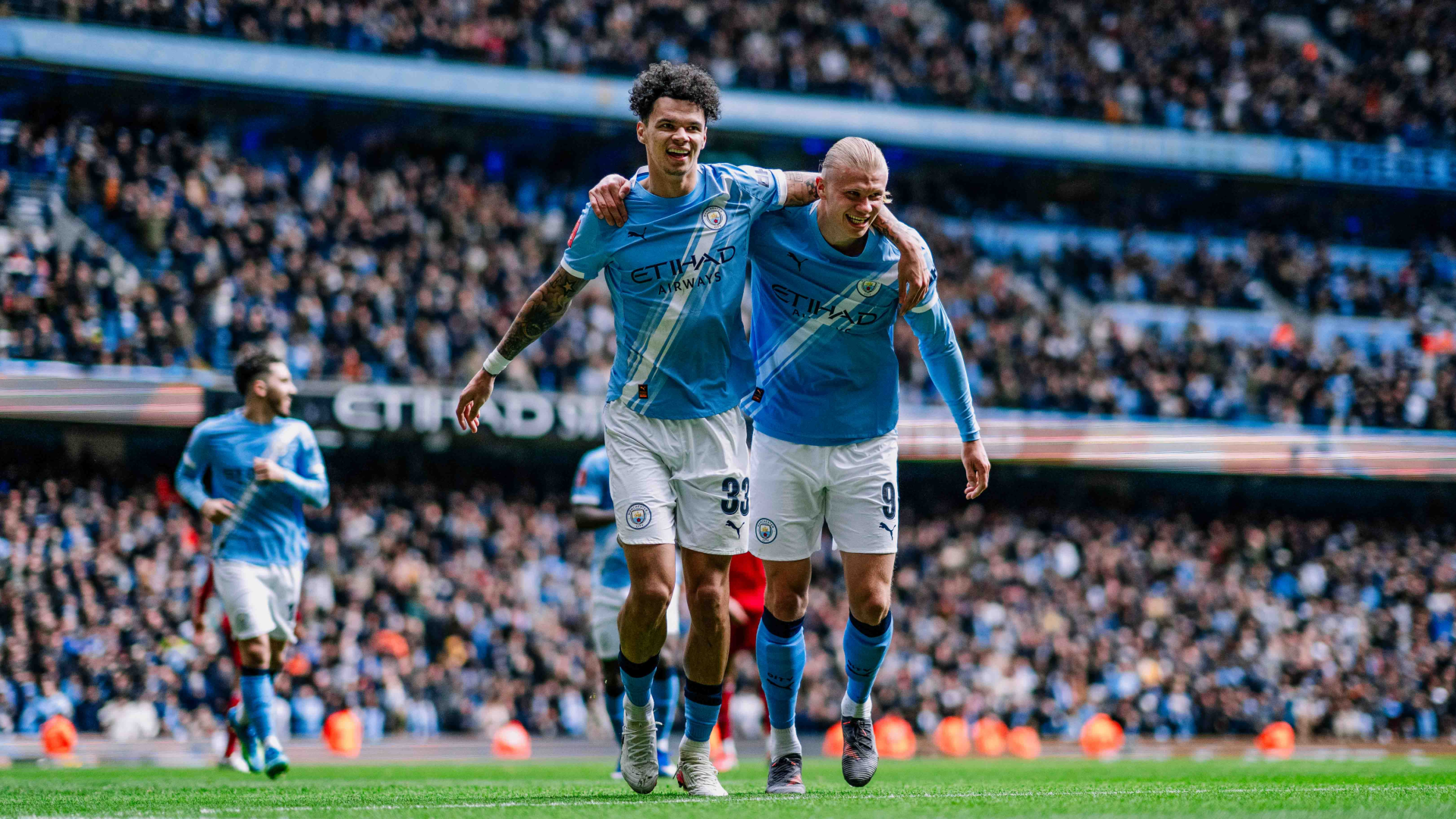 FOURMIDABLE: Erling Haaland celebrates with Nico O'Reilly after sealing his treble.