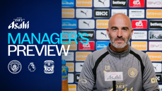 A man in a Manchester City jacket sits at a press conference. Text reads 'Manager's Preview' next to logos for Manchester City and Coventry City. The backdrop displays various sponsor logos.