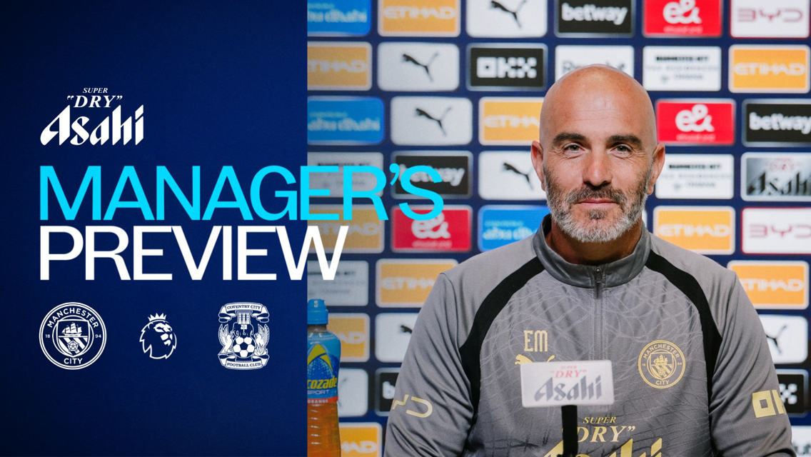A man in a Manchester City jacket sits at a press conference. Text reads 'Manager's Preview' next to logos for Manchester City and Coventry City. The backdrop displays various sponsor logos.