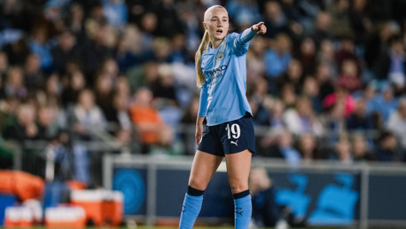 A Manchester City player wearing jersey number 19 is gesturing and pointing during a match.