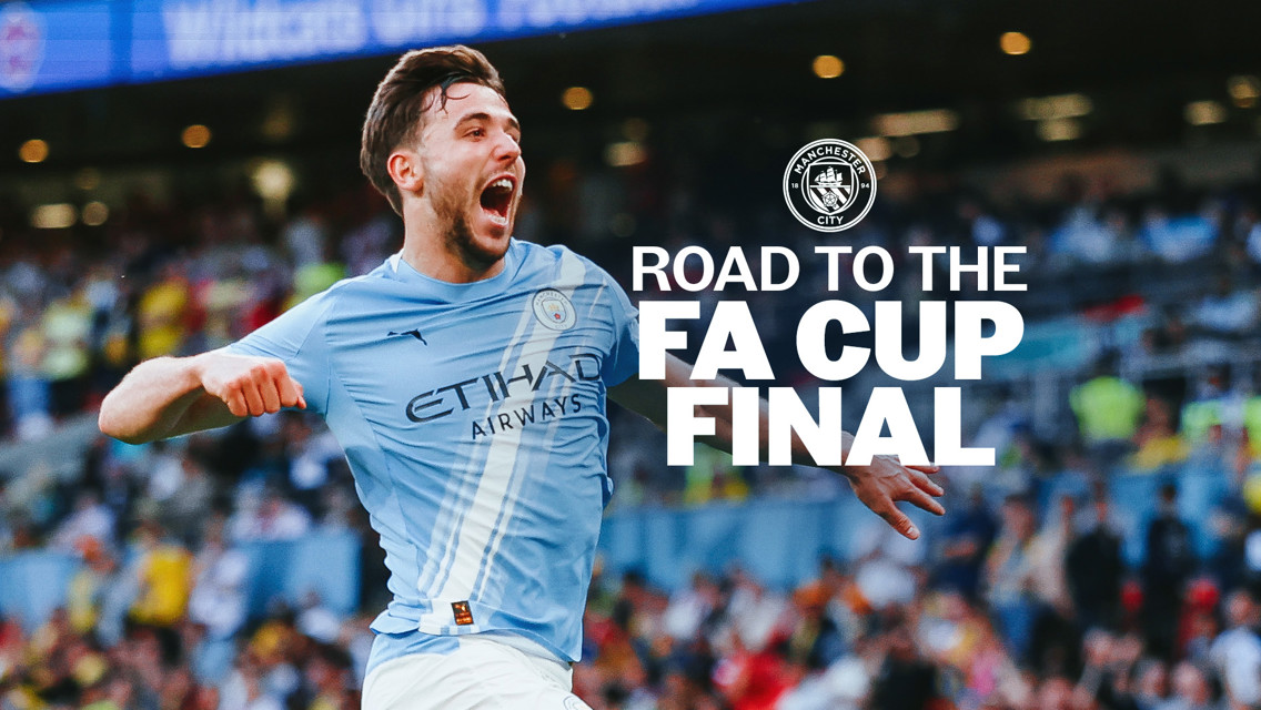 A Manchester City football player in a light blue jersey is celebrating on a football pitch. The background has blurred spectators. Text on the image reads 'Road to the FA Cup Final' with the Manchester City logo.