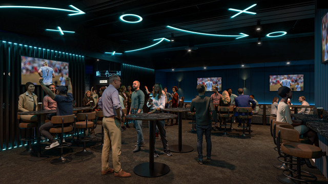 A dimly lit sports bar with multiple screens showing a game. Patrons are standing and sitting at high tables, engaging with each other and the game. The ceiling features neon designs resembling sports tactics.