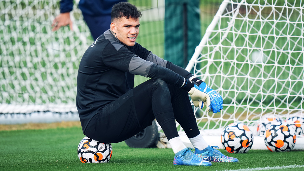 STEADY EDDIE : Ederson rests between drills