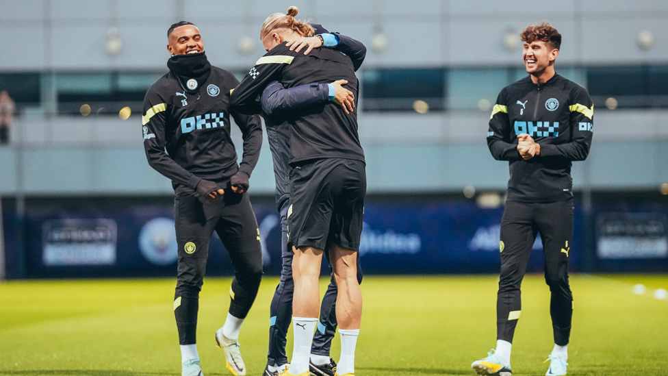 HUGGING HAALAND : Erling Haaland is embraced by boss Pep Guardiola