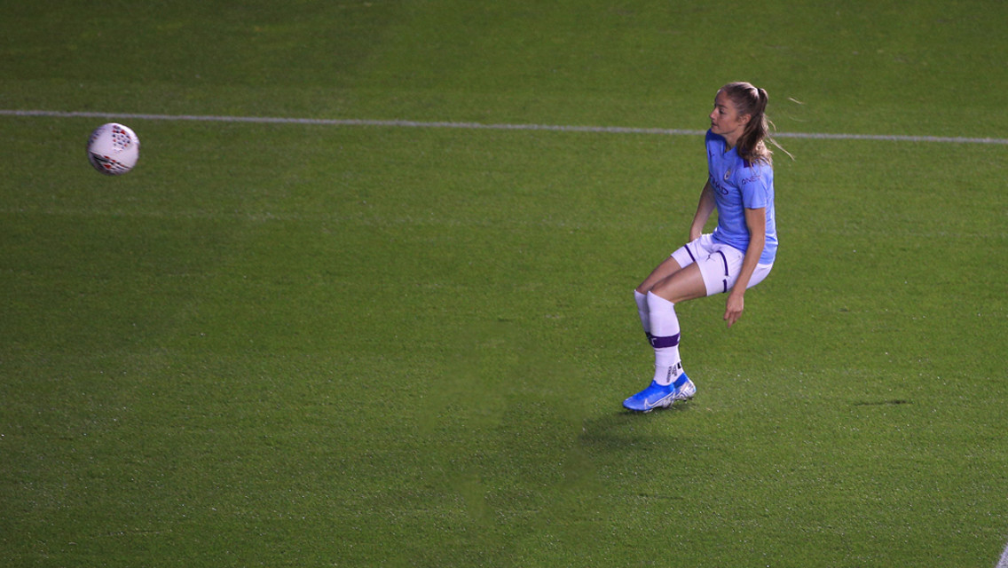 CHIP TOP: Janine Beckie clips the ball over Morgan Bertsch for City's opener