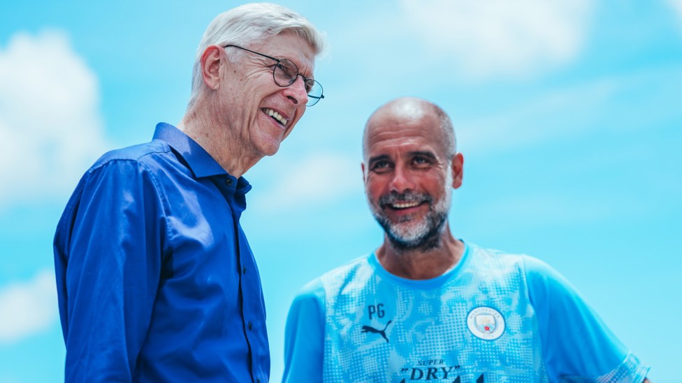 MEETING OF MINDS : Wenger and Pep have a chat